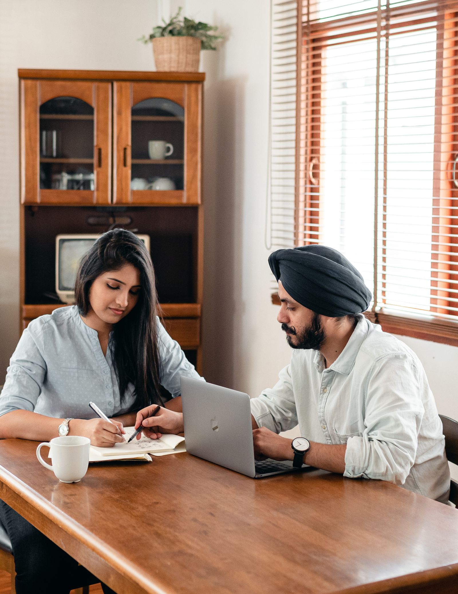 Indian tutor giving individual academic guidance at a study desk
